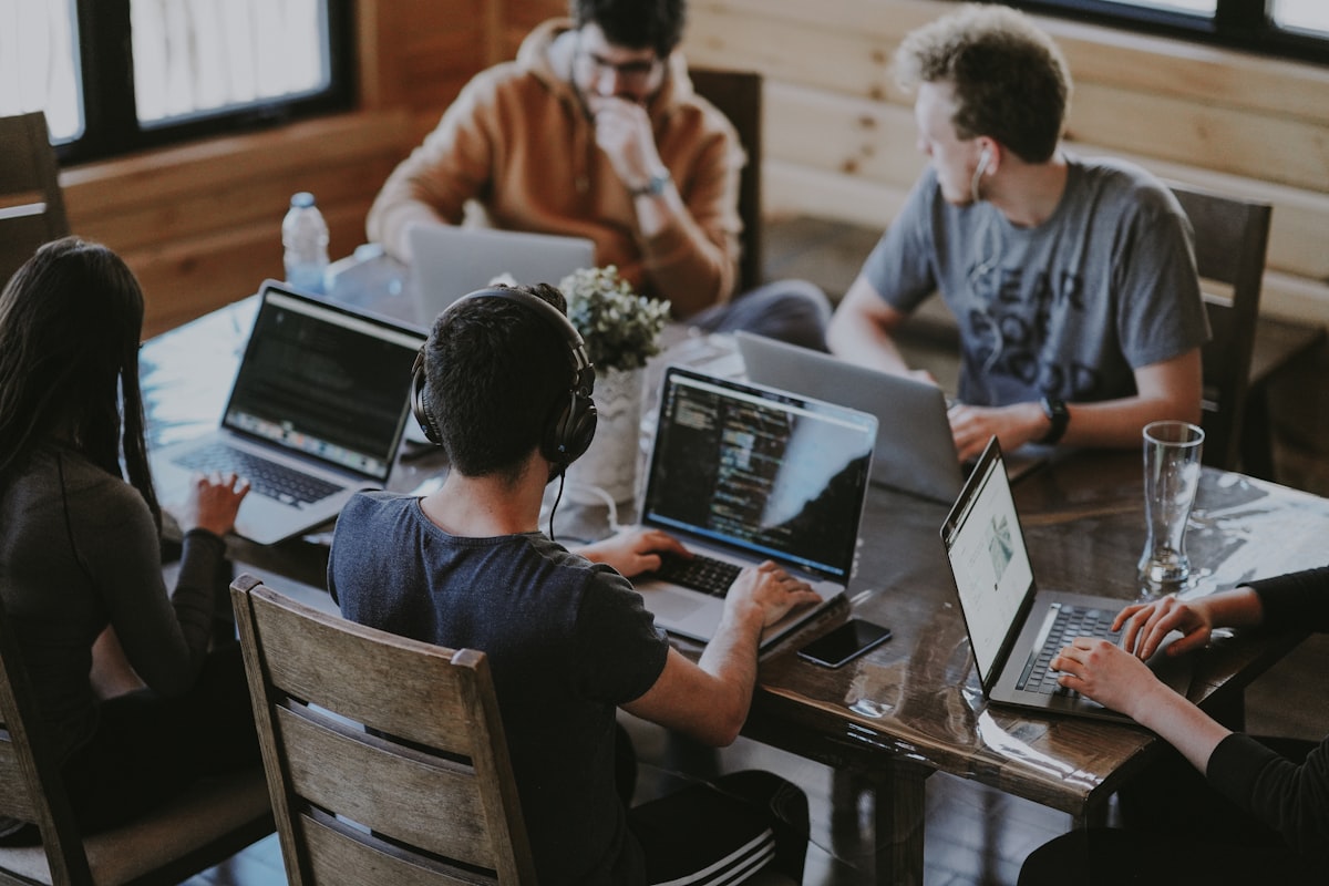 Professional team reviewing a customer journey map together in a modern office