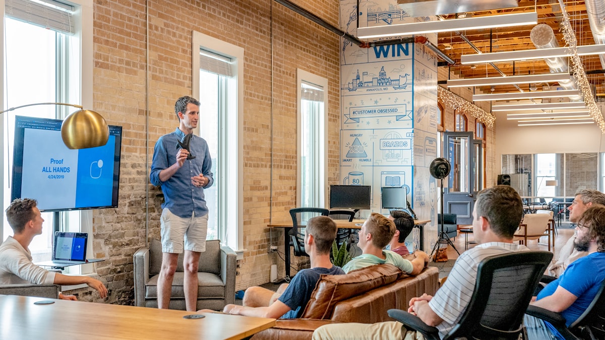 Team collaborating on long-term customer support plans in a bright workspace